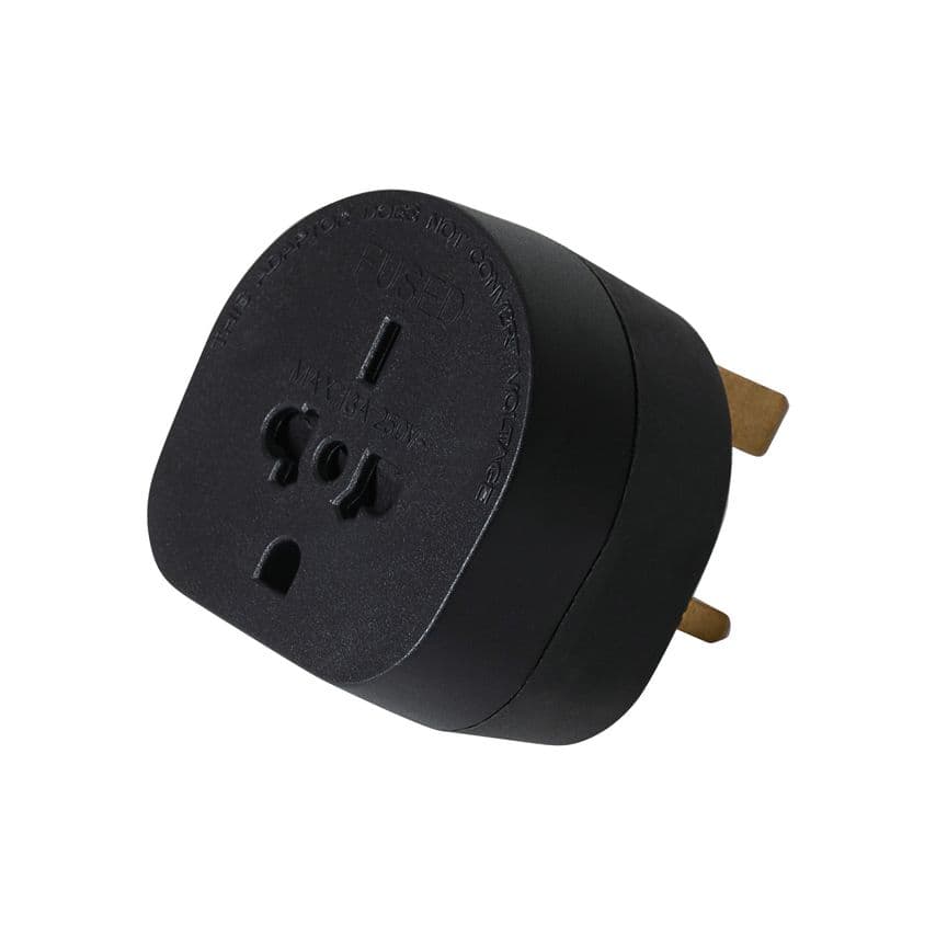 Black plastic travel adapter plug with three prongs, featuring a circular design and labeled with "USED" and voltage information, ideal for connecting devices to UK sockets.