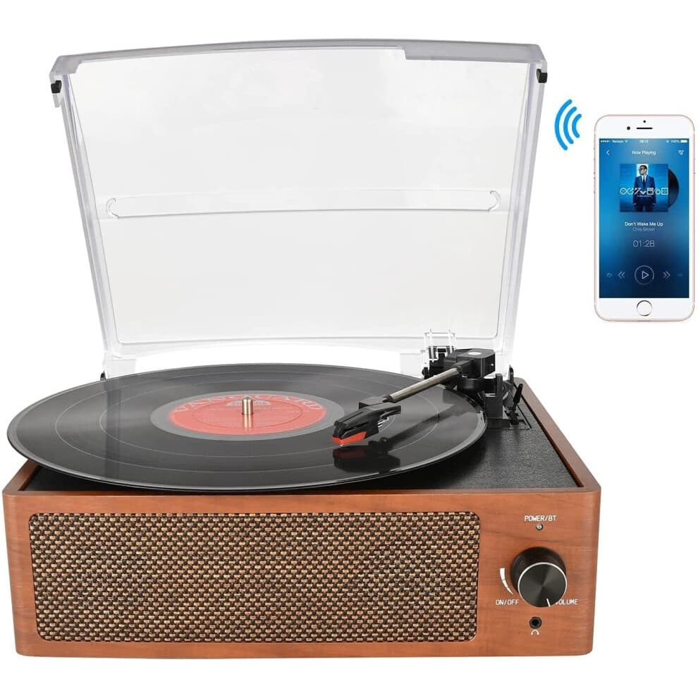 Bluetooth-enabled, vintage-style turntable with a wooden finish, built-in stereo speakers, and a clear lid, featuring a 3-speed belt-driven system and headphone jack.