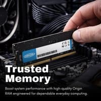 Origin Storage 32GB DDR5 SODIMM ECC RAM, black with label, held above a computer motherboard.