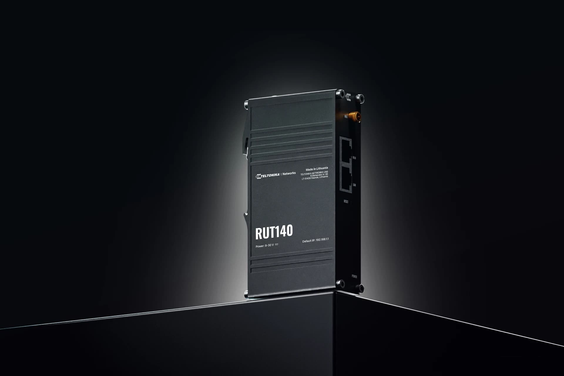 Black metal router with a sleek design, featuring the model number "RUT140" prominently displayed, multiple Ethernet ports, and a compact, modern aesthetic.