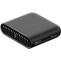 Black TP-Link TL-WR3002X wireless router, compact design, vented sides, dual-band, Gigabit Ethernet ports.