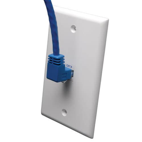 Blue Cat6 Ethernet cable with a molded connector plugged into a white wall plate, featuring a label indicating "CAT6."