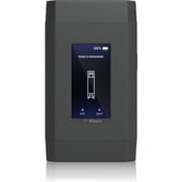 Black Ubiquiti diagnostics device with textured sides, central screen displaying status, and top battery indicator.