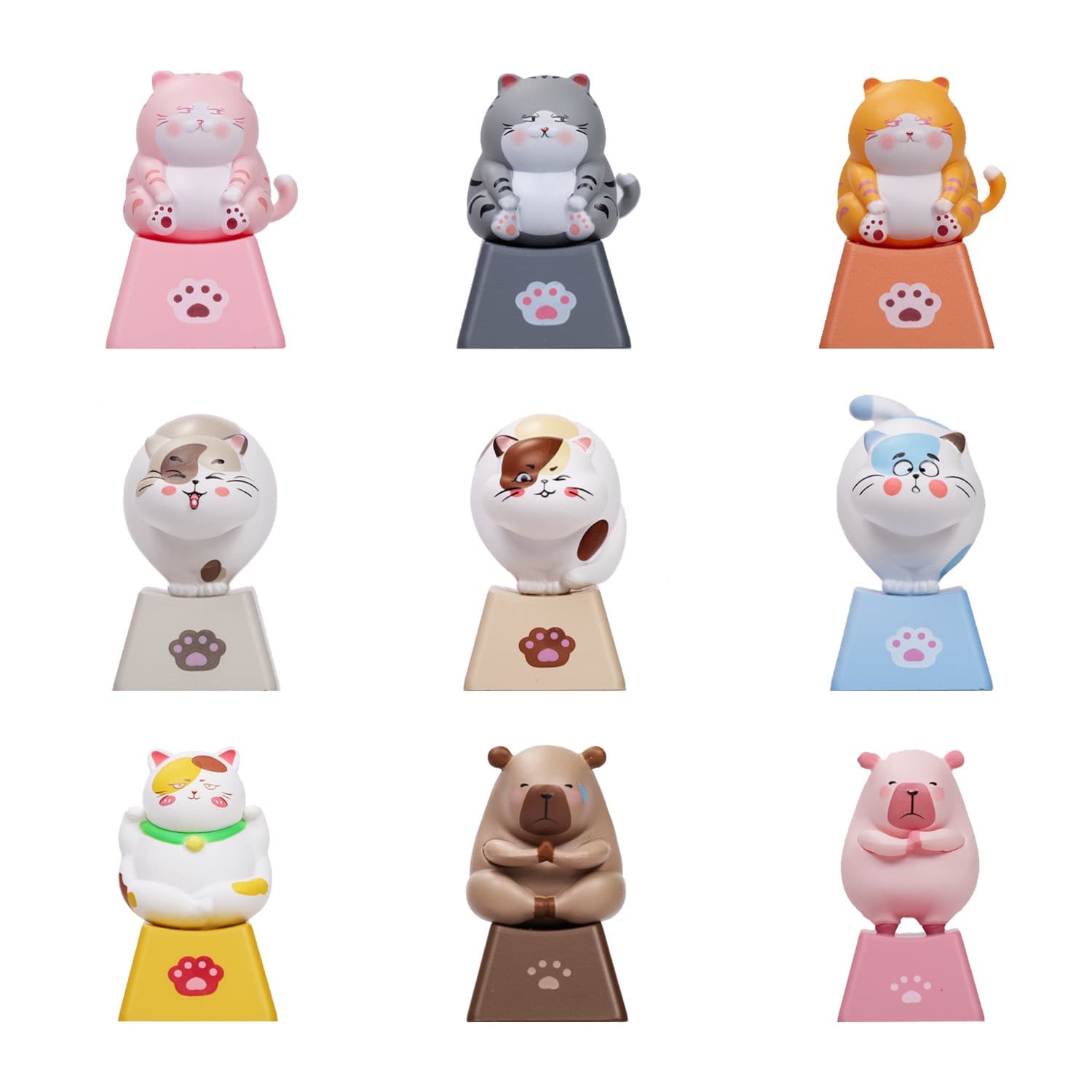 Nine colorful, three-dimensional keycaps shaped like cute animals, including cats and bears, on triangular bases, ideal for Cherry MX mechanical keyboards.