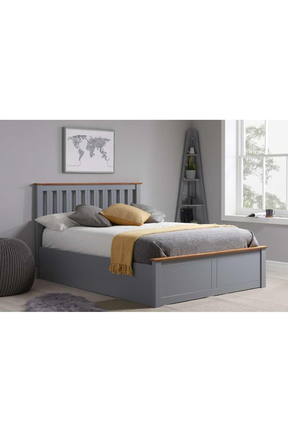 Dark grey solid wood ottoman storage bed frame with gas lift, featuring a slatted headboard and contrasting light wood accents, styled in a modern bedroom setting.