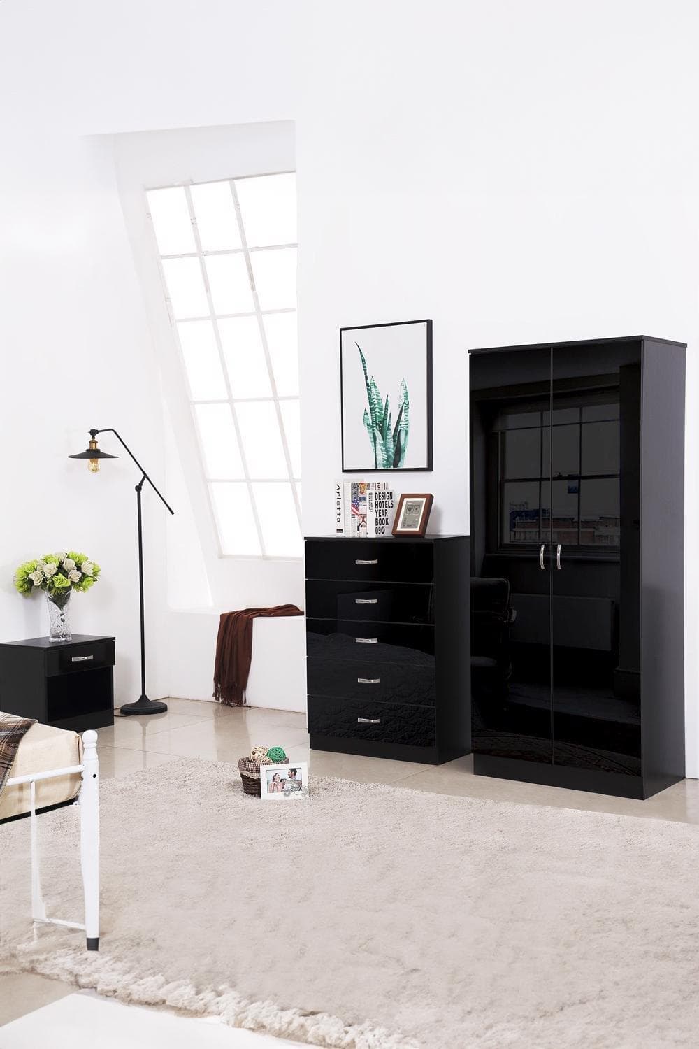 High gloss black double door wardrobe with sleek design, featuring two doors and a modern finish, set against a bright room with a lamp and decorative elements.