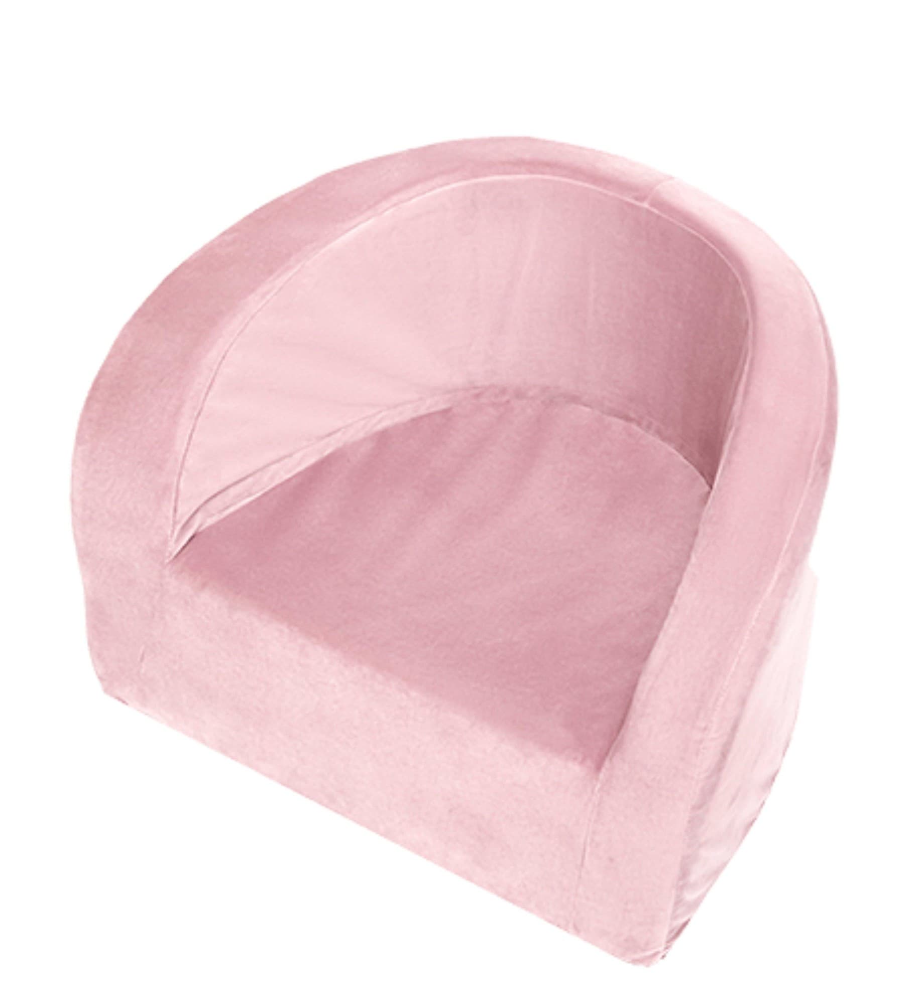 Pink toddler armchair made of soft velvet, featuring a rounded back and cushioned seat, designed for comfort and style in children's spaces.