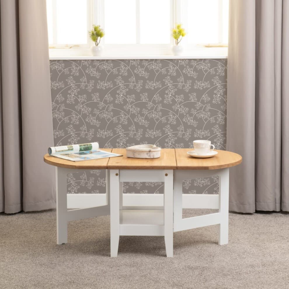 Santos Drop Leaf Coffee Table features a natural wood top with a light oak finish and a white painted base, designed with two drop leaves and a modern, minimalist style.