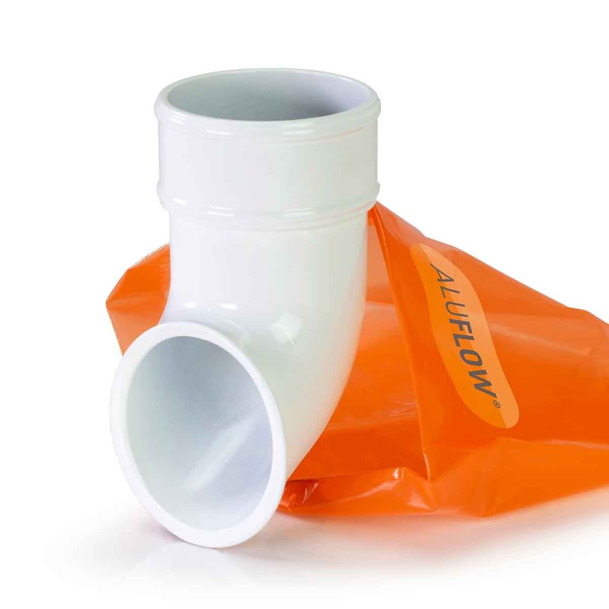White Aluflow downpipe shoe made of durable plastic, featuring a smooth finish and a 90-degree angle, accompanied by a bright orange bag with "ALUFLOW" branding.