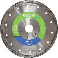 Coreplus Turbo Diamond Blade for hard tile, silver with green and blue label, perforated edges, central hole.