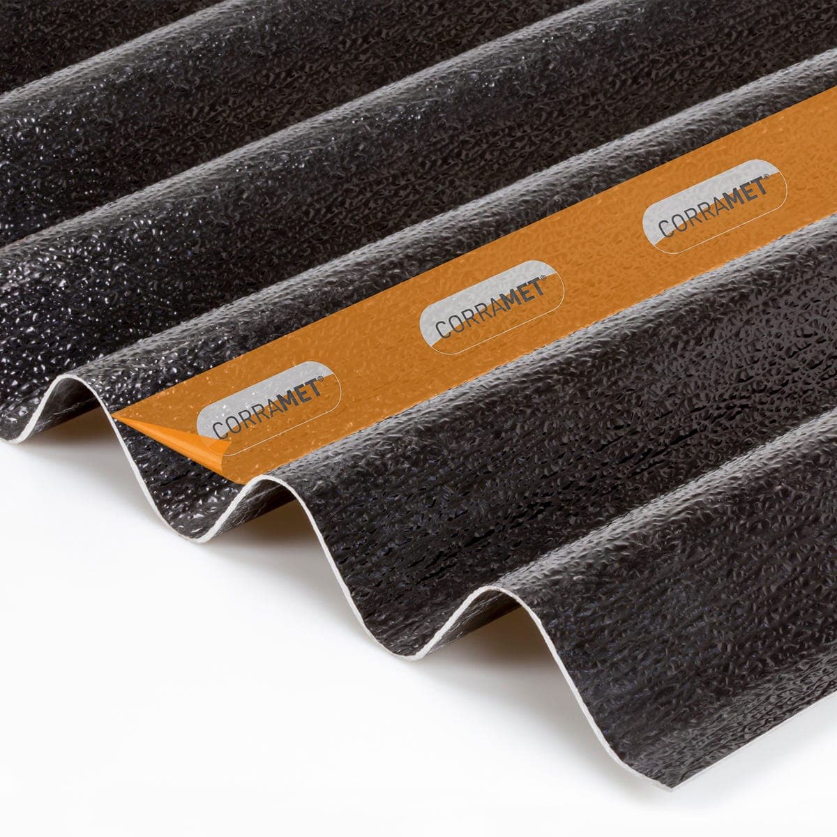 Black corrugated roof sheet kit measuring 950 x 4000mm, featuring a textured surface and an orange label with "CORRAMET" branding.