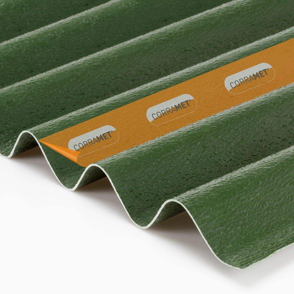 Green corrugated roof sheet kit measuring 950 x 2000mm, featuring a textured surface and a protective orange film with the "CORRAMET" logo visible along the edge.
