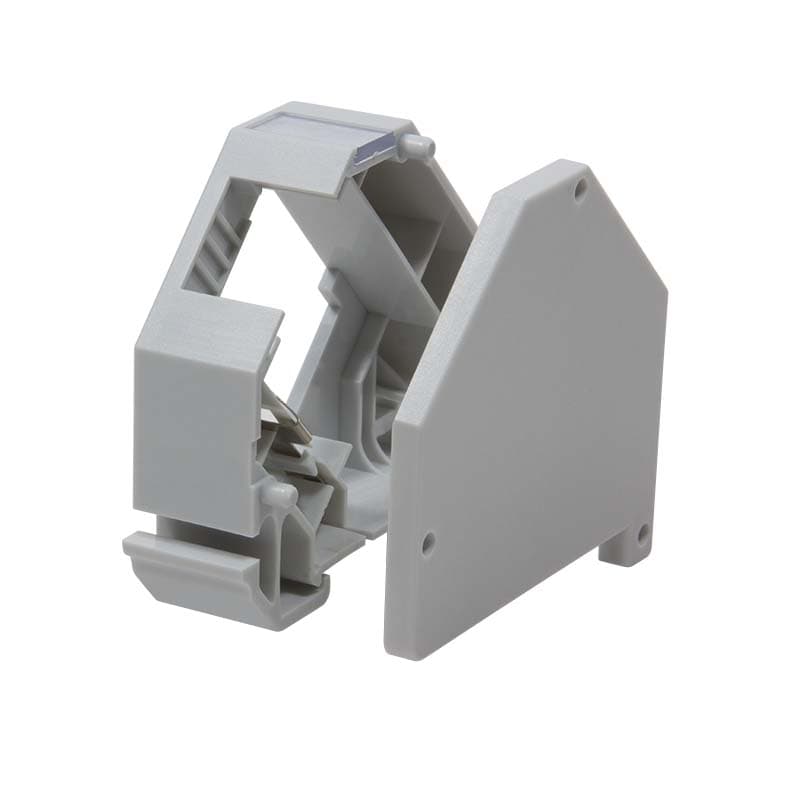 Gray plastic din rail mounted keystone module end cap with a cut-out design for easy installation and secure fit, featuring smooth edges and a compact shape.