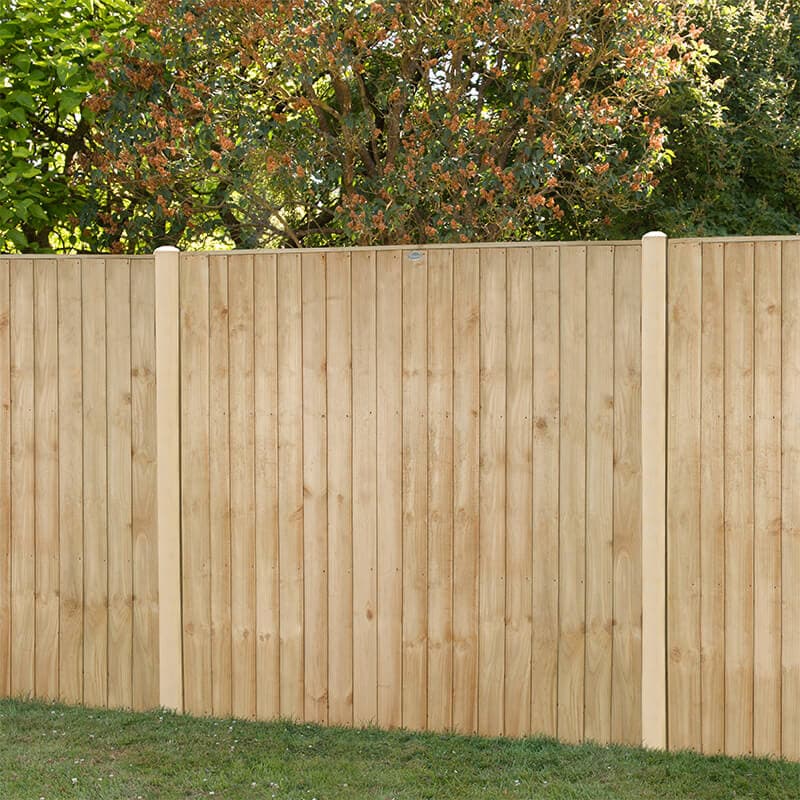 Pressure treated vertical closeboard fence panel in natural wood color, measuring 6' x 5', featuring smooth, straight boards and rounded top posts, set against a green garden backdrop.