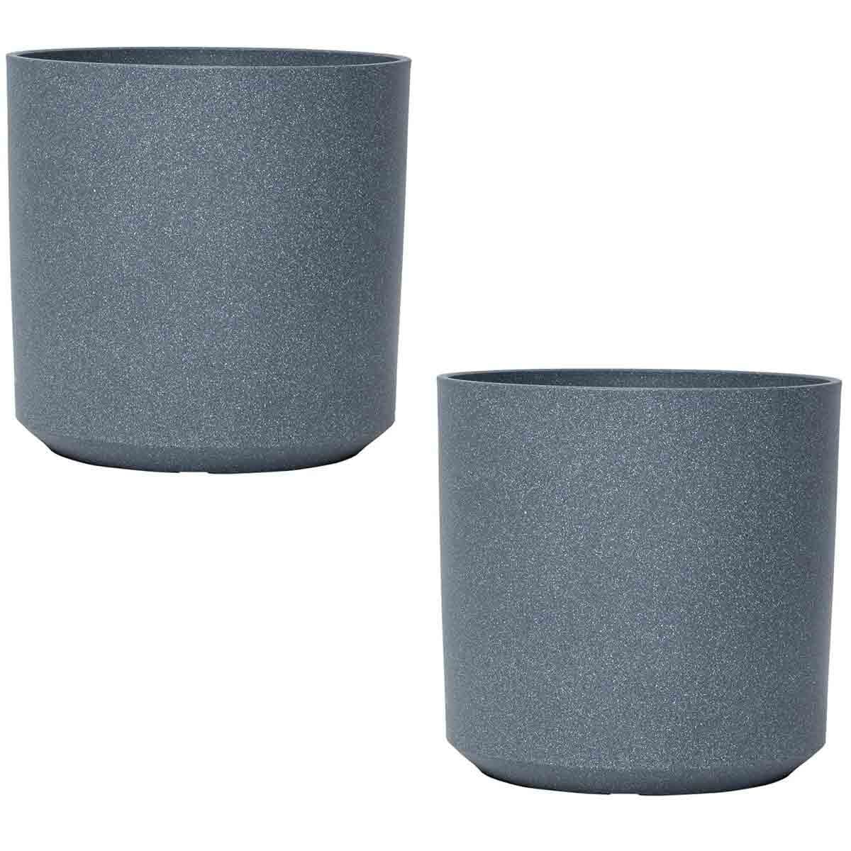 Two small grey cylindrical planters with a textured finish, made from durable material, featuring a minimalist design and a wide opening for easy planting.