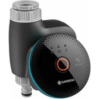 Black Gardena Smart Water Control Timer with digital display, orange button, and gray hose connector.