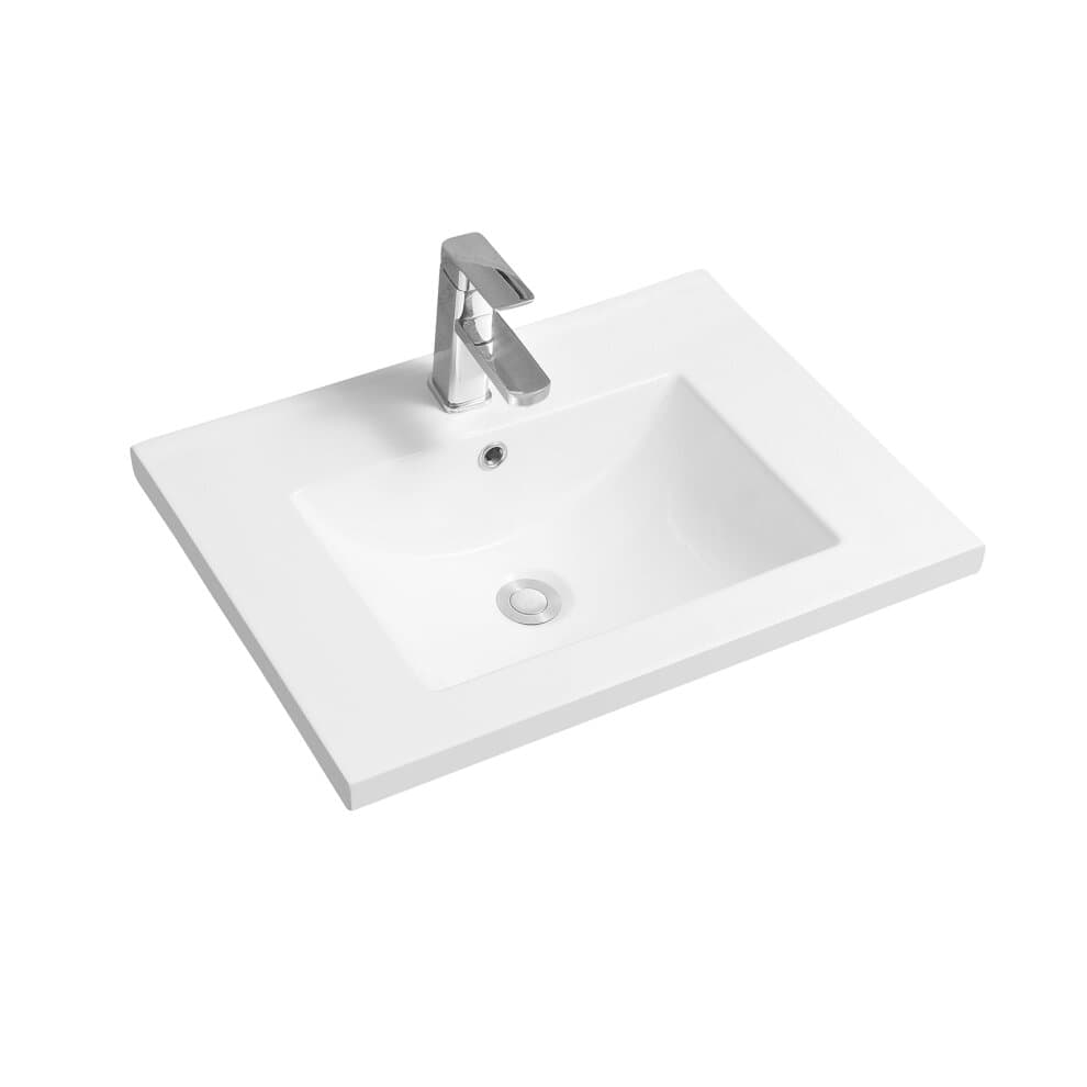 White ceramic inset basin with a scooped mid-edge design, featuring a rectangular shape and a sleek chrome faucet, ideal for modern bathrooms.