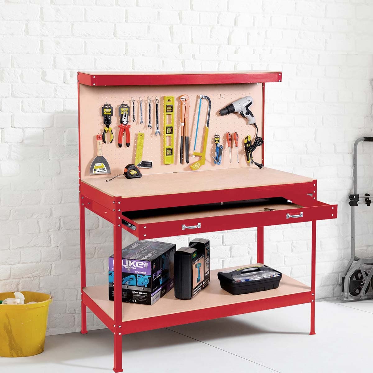 (RED) Neo Workbench featuring a heavy-duty steel pegboard, a sturdy red frame, a wooden work surface, and various tools neatly organized above, with a drawer and storage boxes below.