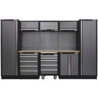 Black and grey Sealey storage system with wood worktop, tall cabinets, drawers, and pegboard backing.