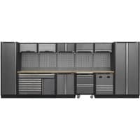 Black and grey storage system with pressed wood worktop, multiple cabinets, drawers, and pegboard backing.