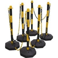 Black and yellow post and chain kit with six striped posts and interconnecting chains, featuring stable octagonal bases.
