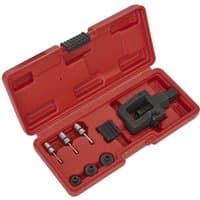 Red Sealey motorcycle chain tool kit with black splitter, riveter, and multiple attachments in a plastic case.