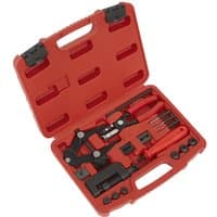 Red Sealey motorcycle chain maintenance tool kit in a hard plastic case with various black and silver tools.