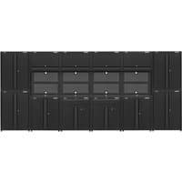 Black Sealey modular garage storage system with multiple cabinets, drawers, and a central workbench area.