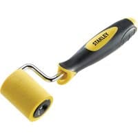 Stanley Dynagrip Wallpaper Seam Roller with yellow rubber roller and black ergonomic handle with yellow accents.