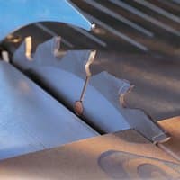 Circular saw blade with 30 teeth, 180mm diameter, silver finish, mounted on a table saw.