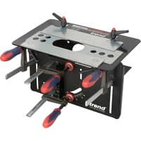 Black and silver Trend Mortise and Tenon Jig with adjustable clamps and red handles.