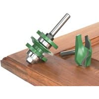 Green and silver Trend panel door set with ogee design, featuring two router bits on a wooden surface.