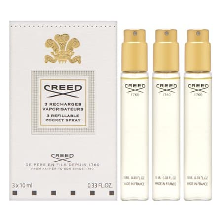 Three 10ml refillable pocket sprays of Creed Royal Princess Oud EDP, housed in a sleek box with gold accents, featuring elegant branding and a luxurious design.