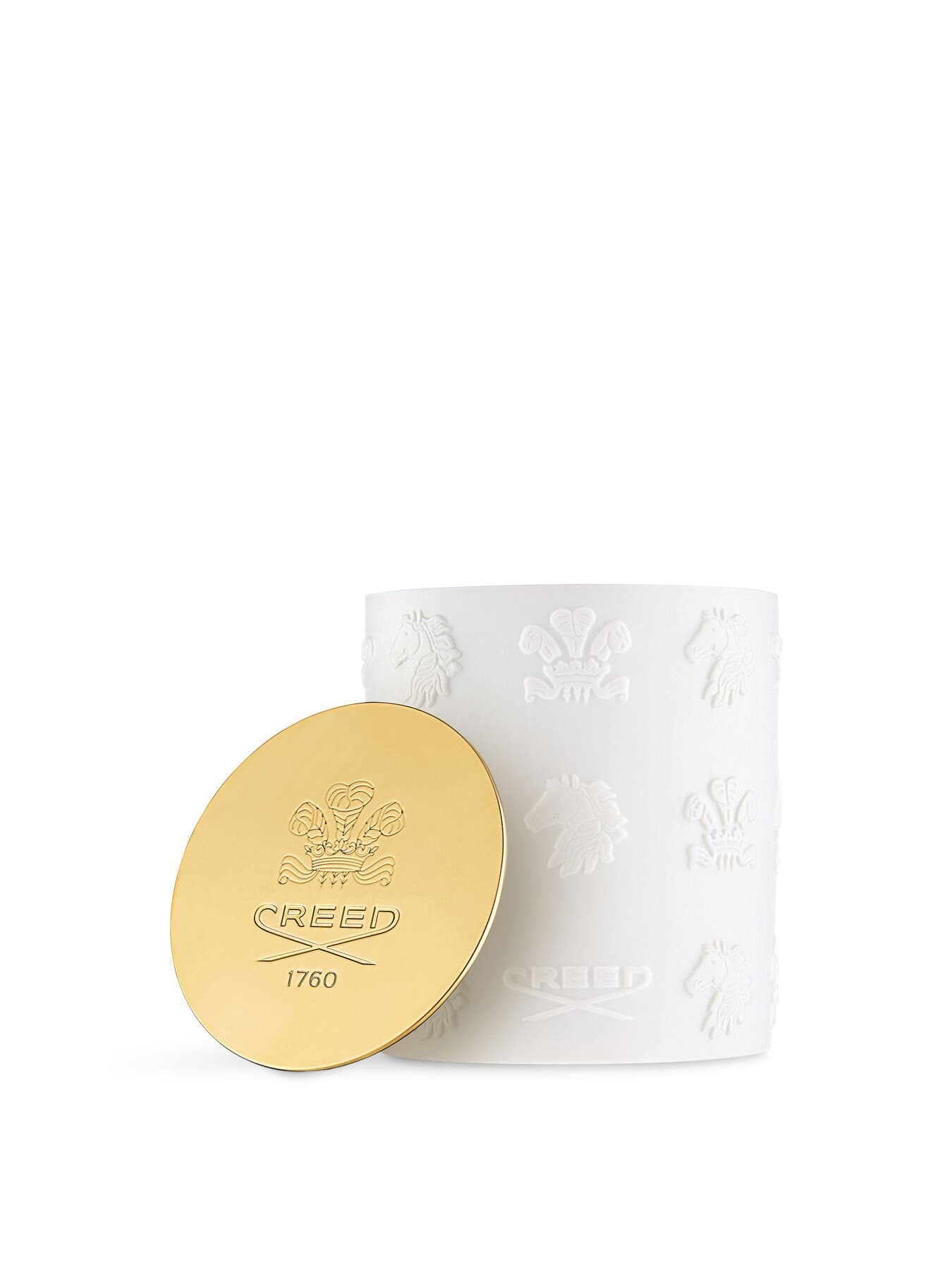 White ceramic candle with embossed CREED logo and gold lid, featuring a textured design and elegant branding, exuding a luxurious aesthetic.