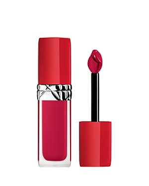 Christian Dior Rouge Dior Ultra Care Liquid Lipstick in shade 760 Diorette, featuring a sleek red tube and a doe-foot applicator, with a vibrant pink-red liquid lipstick.