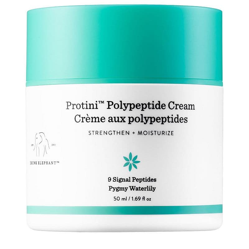 White jar with a turquoise lid, labeled "Protini Polypeptide Cream" by Drunk Elephant, emphasizing "Strengthen + Moisturize" and featuring 9 signal peptides.