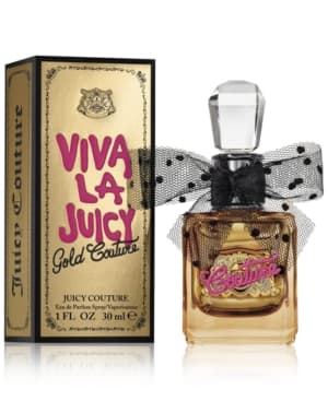 Viva La Juicy Gold Couture Eau De Parfum features a clear glass bottle with a pink logo and a black bow, accompanied by a gold and black box.