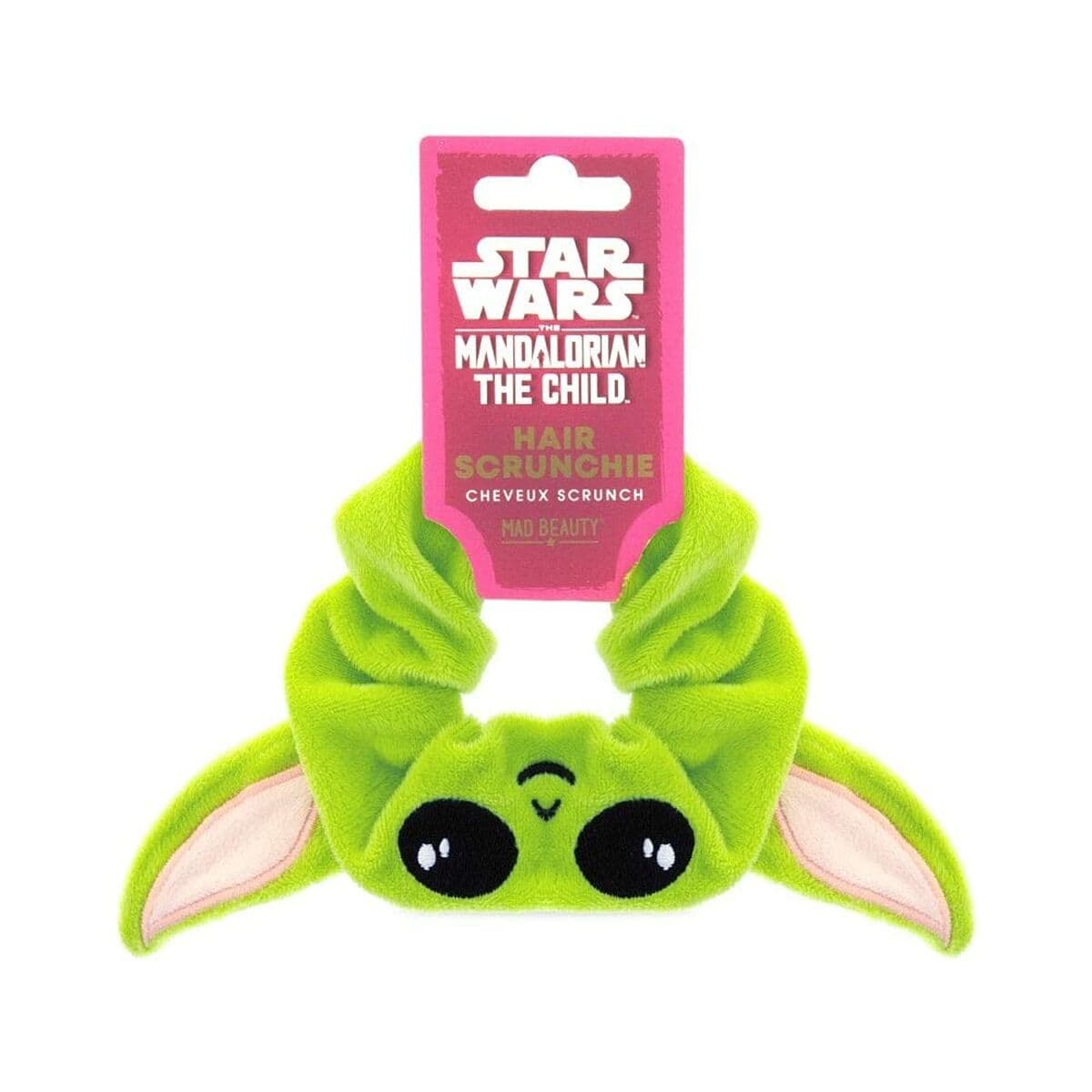 Bright green hair scrunchie featuring large black eyes and floppy ears, inspired by "The Child" from Star Wars, with a tag displaying the Star Wars logo and product details.
