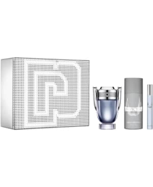 Silver box featuring a dotted logo design, containing a 100ml Eau De Toilette in a trophy-shaped bottle, a 10ml travel spray, and a sleek gray bottle.