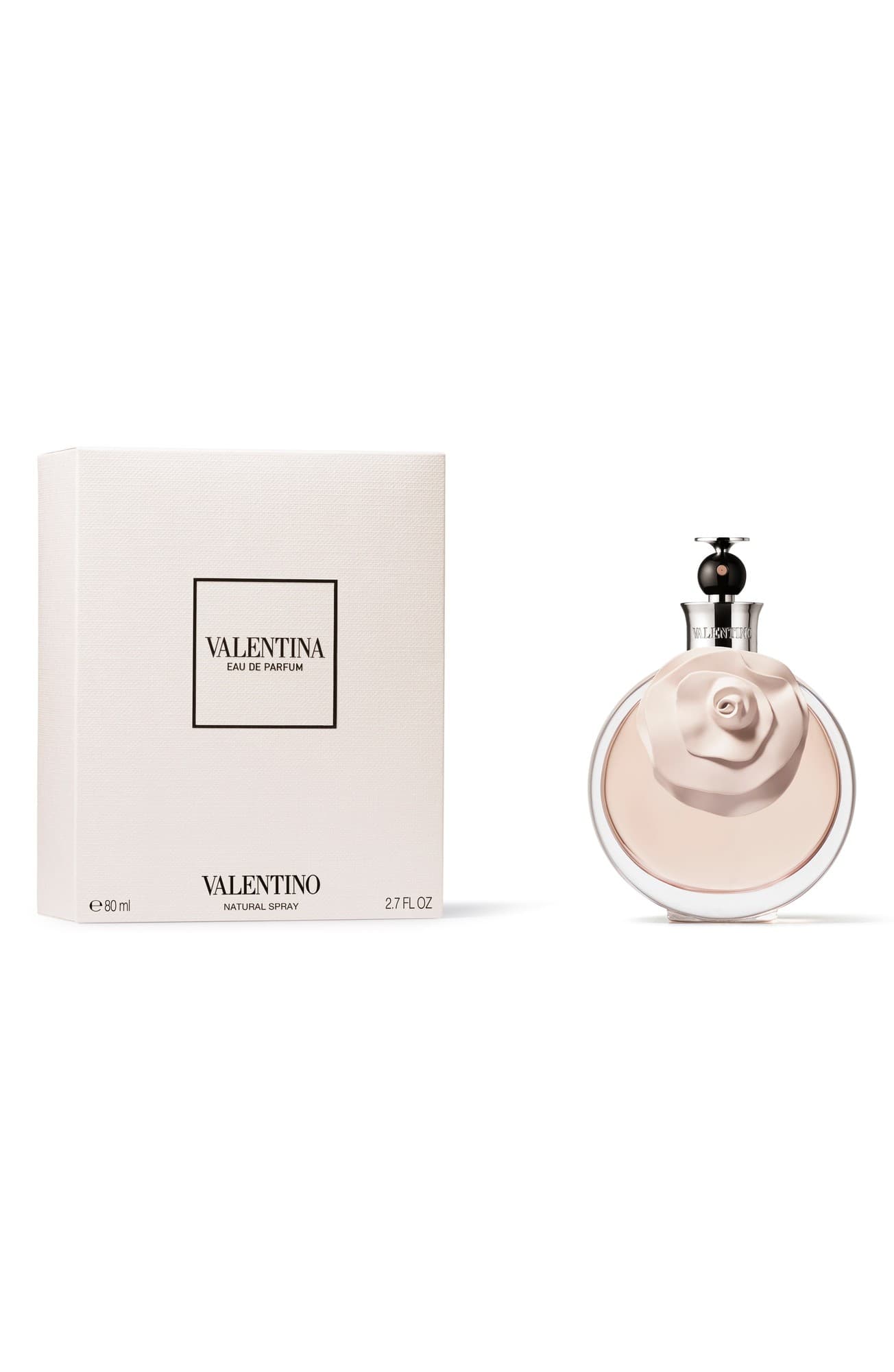 Valentino Valentina Eau de Parfum in a round, pale pink bottle adorned with a rose, accompanied by a sleek white box featuring elegant black lettering.