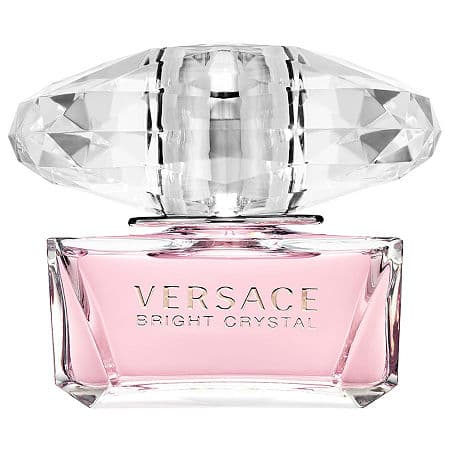 Clear glass bottle with a faceted crystal-like cap, featuring a soft pink liquid and the engraved text "VERSACE BRIGHT CRYSTAL" on the front.