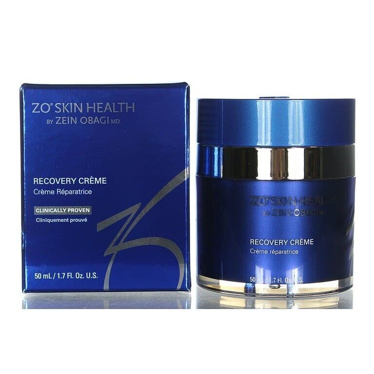Blue and silver jar of ZO Skin Health Recovery Crème, 50ml, with a sleek design and a matching blue box, featuring the brand name and product details prominently displayed.