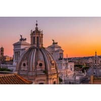 Rome cityscape at sunset with historic domes and statues, part of a 4-star city break package by Travelodeal Limited.