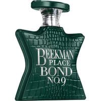 Dark green star-shaped perfume bottle with crocodile texture, silver cap, and "Beekman Place Bond No. 9" text.