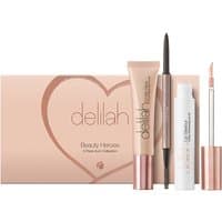 Delilah Beauty Heroes Trio with peach packaging, mascara, eyeliner, and lip gloss in sleek rose gold accents.