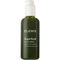 Green bottle of Elemis Superfood Facial Wash with white pump and text, featuring nutrient-rich cleanser.