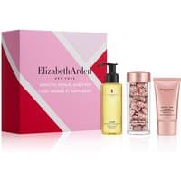 Elizabeth Arden gift set with pink box, serum bottle, capsule jar, and cream tube, all with rose gold accents.