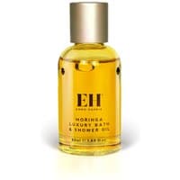 Clear glass bottle with gold cap, containing yellow Emma Hardie Moringa Luxury Bath & Shower Oil, 50ml.