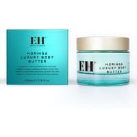 Emma Hardie Moringa Luxury Body Butter in a turquoise jar with gold lid, next to matching turquoise box.