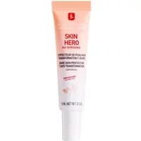 Erborian Skin Hero cream tube, 15ml, white with peach gradient, red logo, and text detailing skin-perfecting benefits.